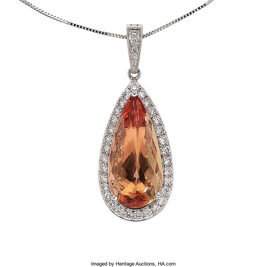 Topaz, Diamond, White Gold Pendant-Necklace The pendant features...