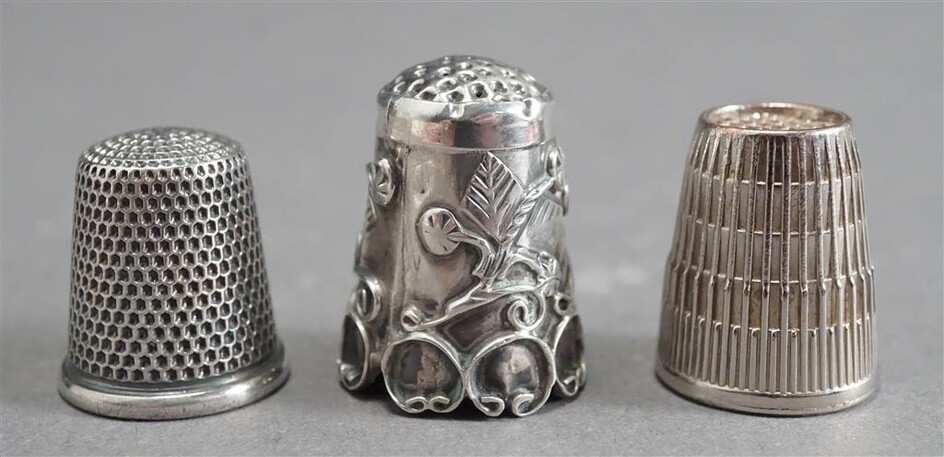 Two Sterling Silver Thimbles and One Metal Thimble