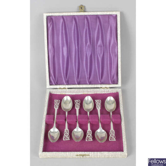 Two cased sets of mid-20th silver coffee spoons.