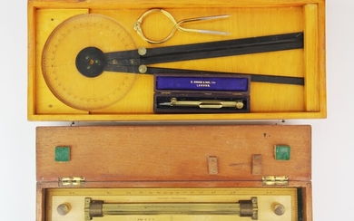 Two cases containing four navigational instruments.