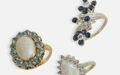 Two opal rings and a sapphire and diamond ring