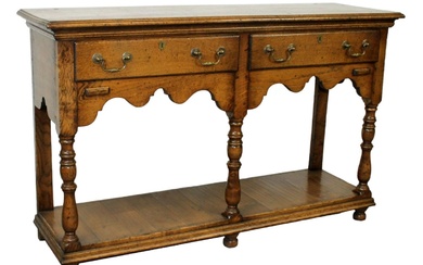 Welsh cupboard style console in oak with scalloped apron