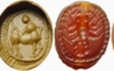 Lot made of two carnelian engraved scarabs: a centaur (presence...