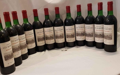 12 bottles château LES BARDES 1975 MONTAGNE SAINT EMILION. Beautiful label, 5 low neck and 7 high shoulder.
