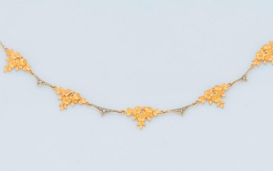 18 karat (750 thousandths) yellow gold necklace composed of five triangular motifs, stylizing a bouquet of chiselled flowers, alternating with arched motifs enhanced with rose-cut diamonds.