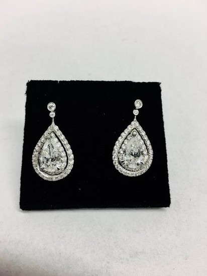 2.04ct diamond drop earrings. Each set with a...