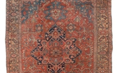 ORIENTAL RUG: HERIZ 10'3" x 13'5" Overlapping blue and salmon red gabled medallions rest at the center of a brick red field with lig.