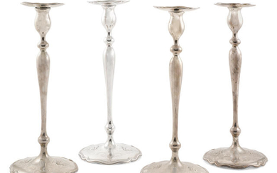 Four American sterling silver base loaded candlesticks
