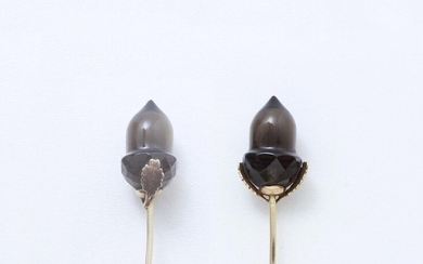 585-thousandths gold lapel pin stylizing a partially faceted smoky quartz acorn.