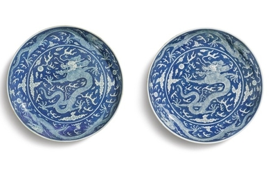 A PAIR OF LARGE REVERSE-DECORATED BLUE AND WHITE 'DRAGON' DISHES DAOGUANG SEAL MARKS AND PERIOD