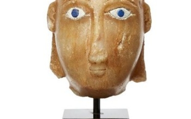 An alabaster head with inlaid eyes, South...