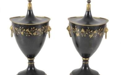 A pair of black and gold painted and lacquered metal chestnut urns and covers in the style of Regency toleware