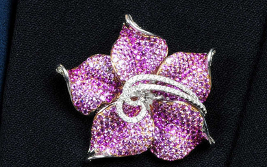 A diamond and pink sapphire flower brooch.May be worn