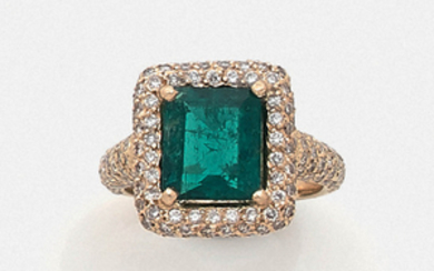 EMERALD RING A step-cut emerald, diamond and gold...