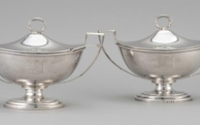 PAIR OF GEORGE III STERLING SILVER COVERED SAUCE TUREENS AND TWO SAUCE LADLES Tureens: 1804-05, Robert Garrard I, maker. Engraved wi...