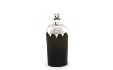 HENRY IRVING INTEREST: a silver-mounted glass bottle