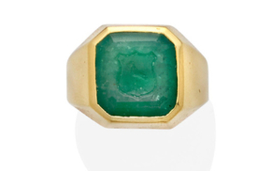 An intaglio emerald and 18k gold ring