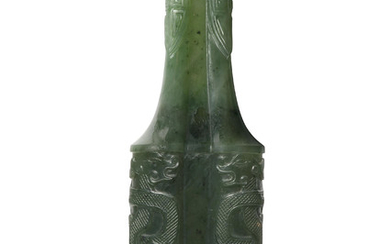 A SMALL SPINACH-GREEN JADE ARCHAISTIC QUATREFOIL ‘DRAGON’ VASE, EARLY 20TH CENTURY