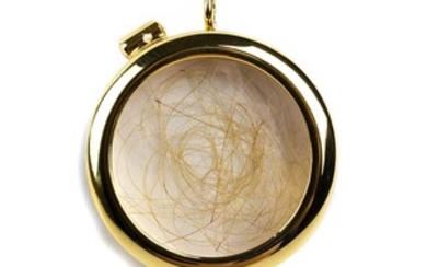 Strand of hair of Evita Perón preserved in a round...