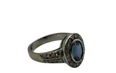 A 18ct white gold sapphire and diamond ring, central...