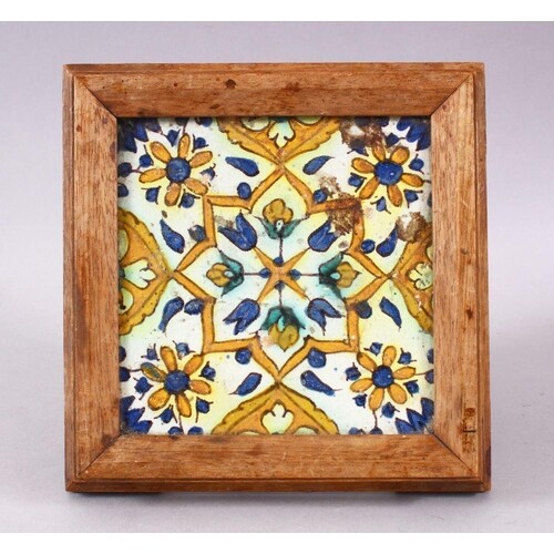 A 19TH / 20TH CENTURY TURKISH POTTERY TILE SECTION, housed w...