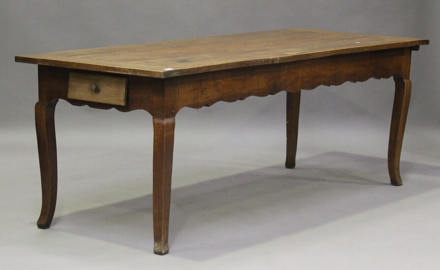 A 19th century French cherrywood kitchen table, fitted with a drawer and slide, on cabriole legs, he
