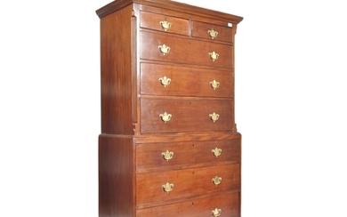 A 19th century George III mahogany chest on chest of drawers...