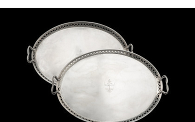 A 19th-century pair of silver double-handled trays. Engraved with coat of arms. Undeciphered silversmith (cm 56x37) (g 3300 ca.)