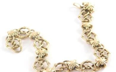 A 9ct gold bracelet, fancy link with elaborate loop...