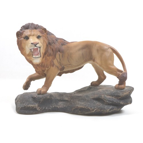 A Beswick 'Lion on Rock', model 2554A, golden brown, satin m...