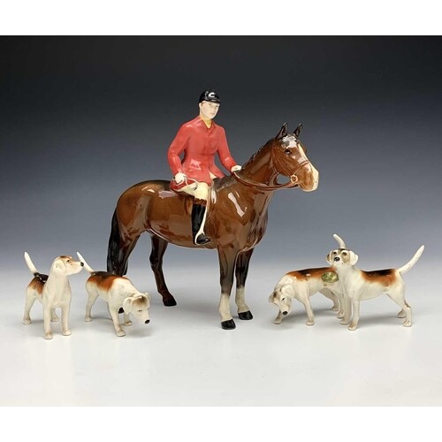 A Beswick pottery hunter on horse, height 20cm, together wit...