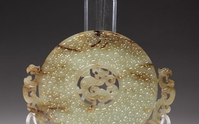 A CHINESE ARCHAISTIC CARVED JADE DISC BI