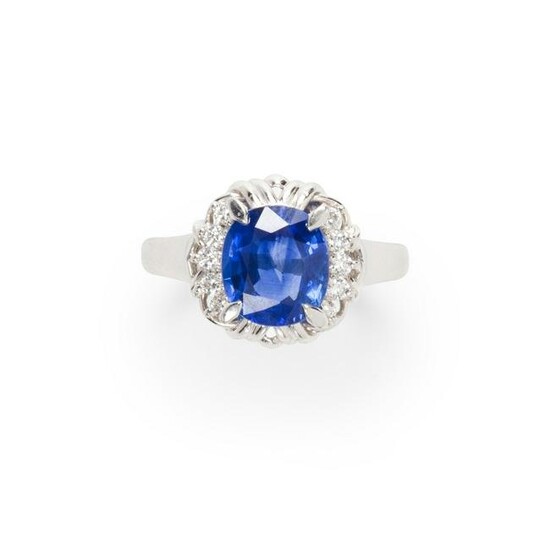 A Ceylon sapphire, diamond and platinum ring