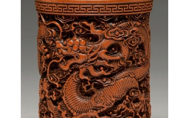 A Chinese bamboo brush pot, 20th c, carved with dragons betw...