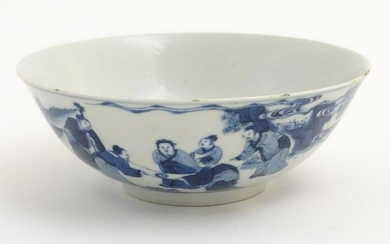 A Chinese blue and white bowl depicting figures in a