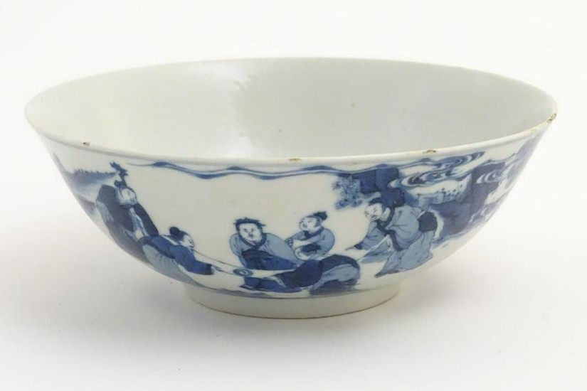 A Chinese blue and white bowl depicting figures in a