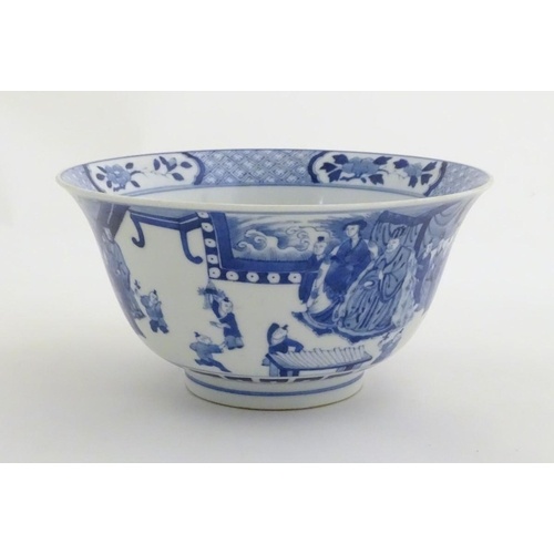 A Chinese blue and white footed bowl with a flared rim, deco...