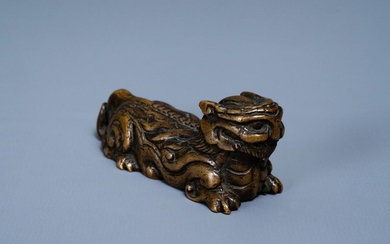 A Chinese bronze 'mythical beast' scroll weight, Ming...