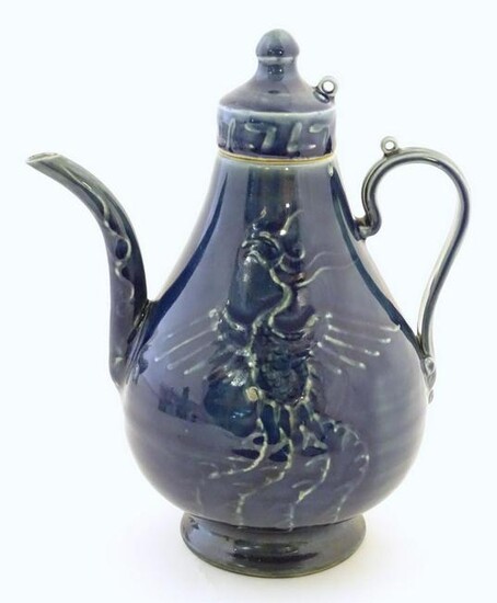 A Chinese pear shaped teapot with phoenix bird
