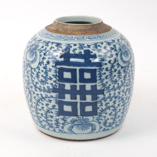 A Chinese porcelain blue and white 'double happiness' jar, 19th century, painted with floral blooms amidst leafy stems, 20.5cm high