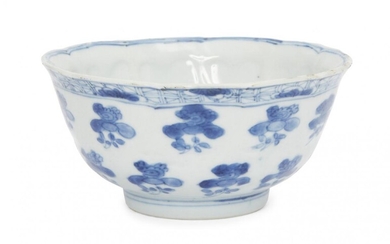 A Chinese porcelain moulded bowl, Kangxi period, painted in underglaze...