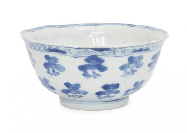 A Chinese porcelain moulded bowl, Kangxi period, painted in underglaze...