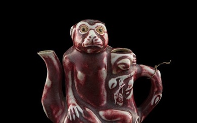 A Chinese red-glazed monkey-form teapot, 19th century