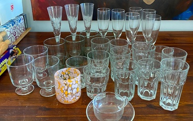 A Collection of Glassware including Champagne Flutes, Tumblers