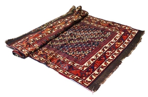 A GOOD CAUCASIAN CARPET with a centre with numerous