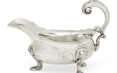 A George II silver sauce boat, London, c.1748, maker's mark rubbed, designed with three paw feet to lion mask shoulders, the floral scroll chased body to double scroll handle and shaped rim, 18.5cm long 13.6cm high (both inc. handle), approx...