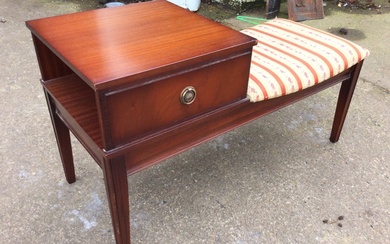 A mahogany telephone table with square top above an open...