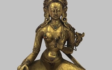 A Gilt Bronze Figure of Green Tara, Tibet, 17 - 18th Century.