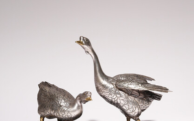 A JAPANESE SILVERED BRONZE OKIMONO OF TWO GEESE BY CHIKAYOSHI