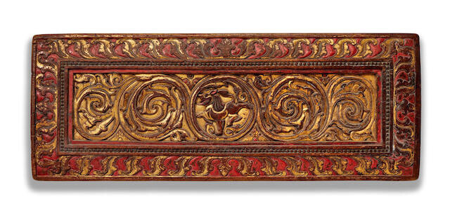 A LARGE GILT LACQUERED WOOD MANUSCRIPT COVER WITH A LION